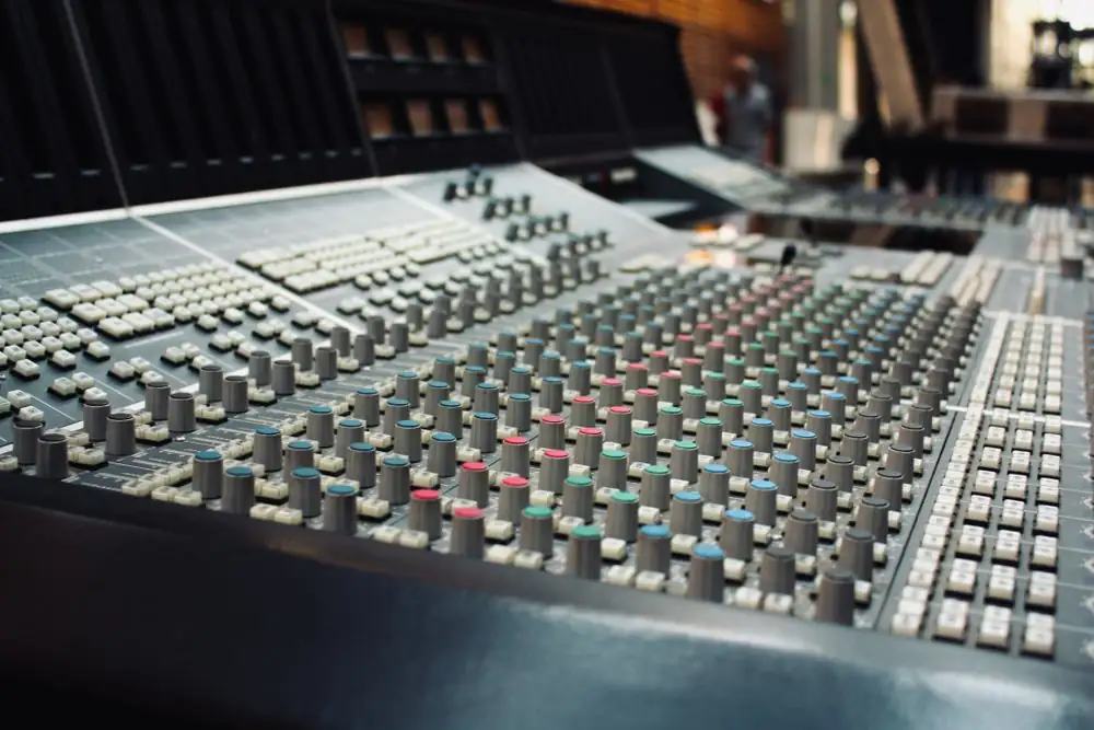 Close-up of a professional audio mixing console in a recording studio in Ciudad de México, Mexico.