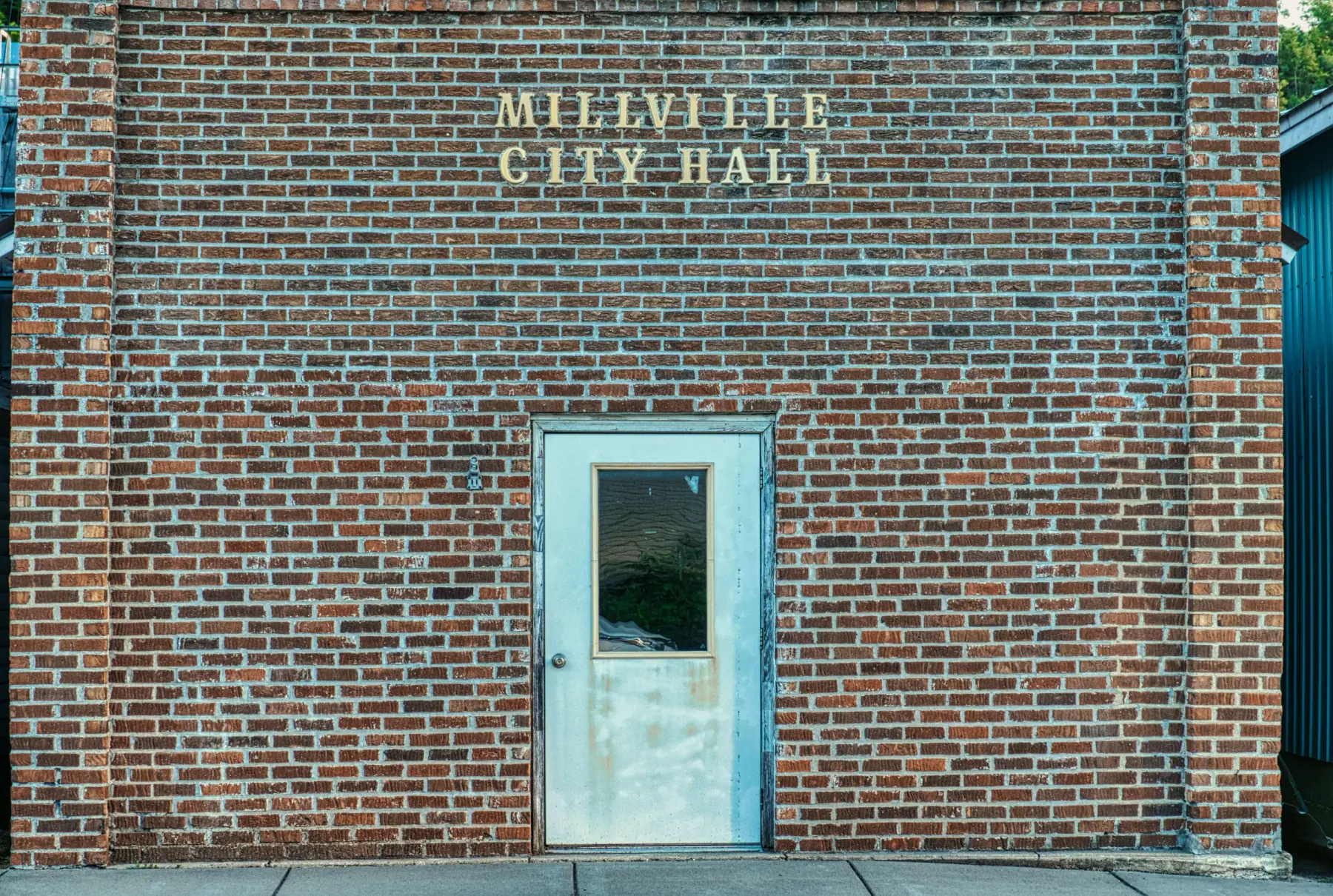 Brick facade and entrance of a small city hall