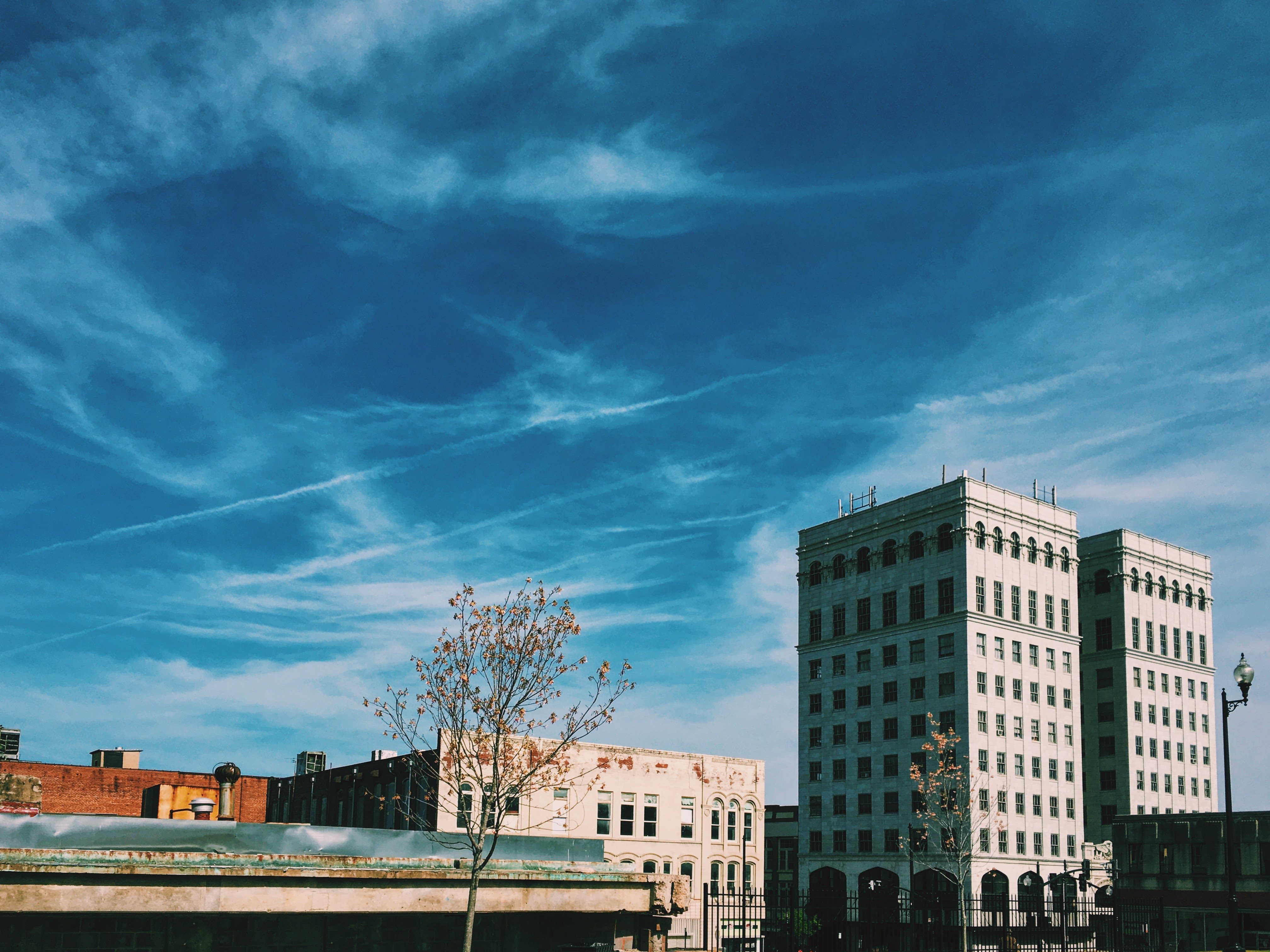 Buildings in downtown Danville beneath a blue sky.