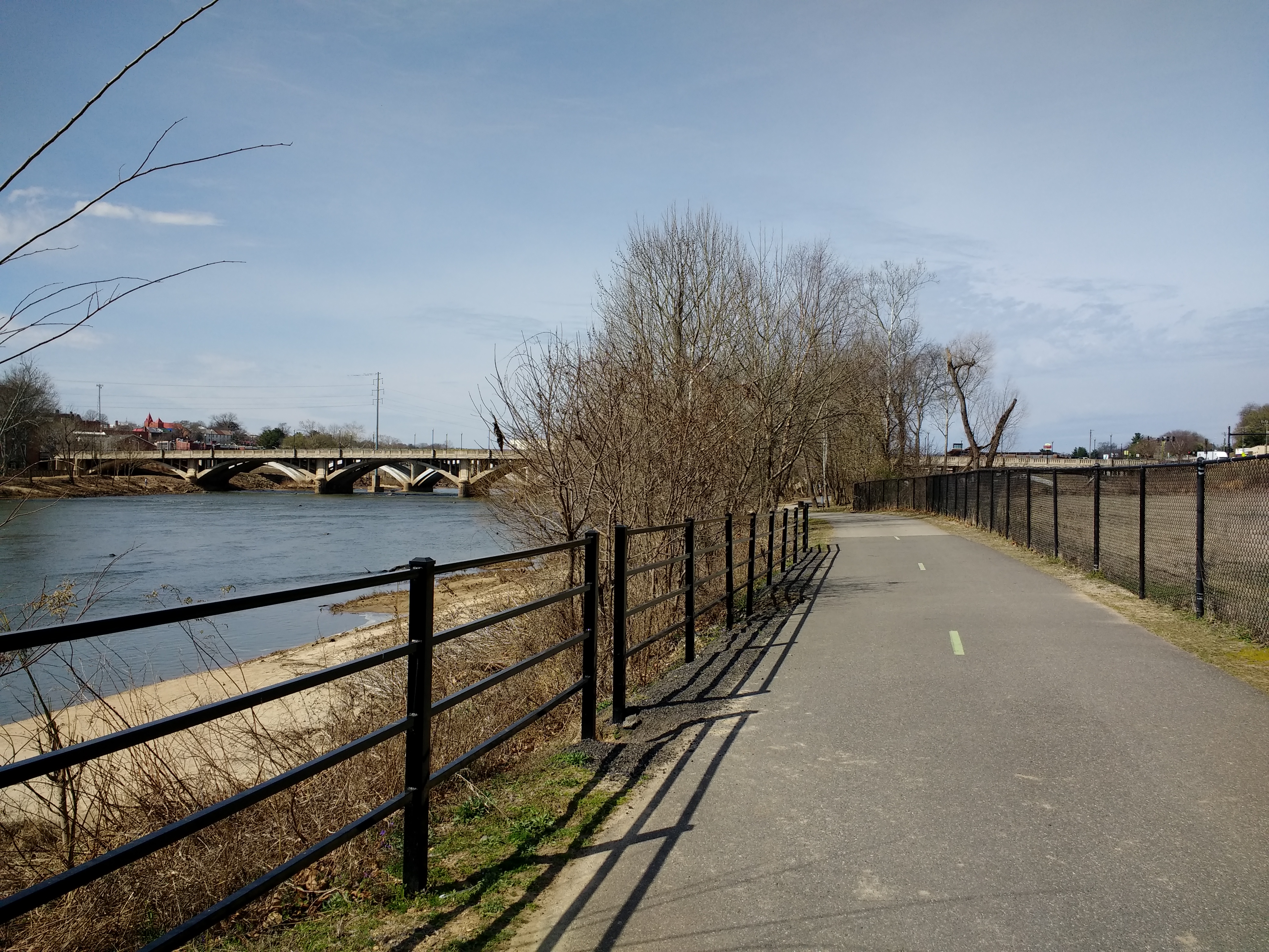 A paved Riverwalk Trail beside the Dan River in Danville.