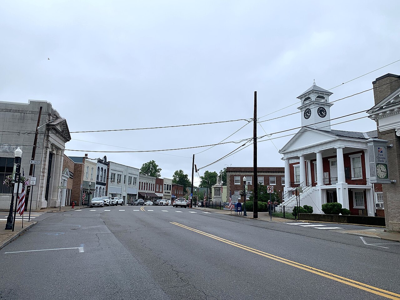 North Main Street in Chatham with storefronts, traffic, and the white-columned Pittsylvania County Courthouse on the right.